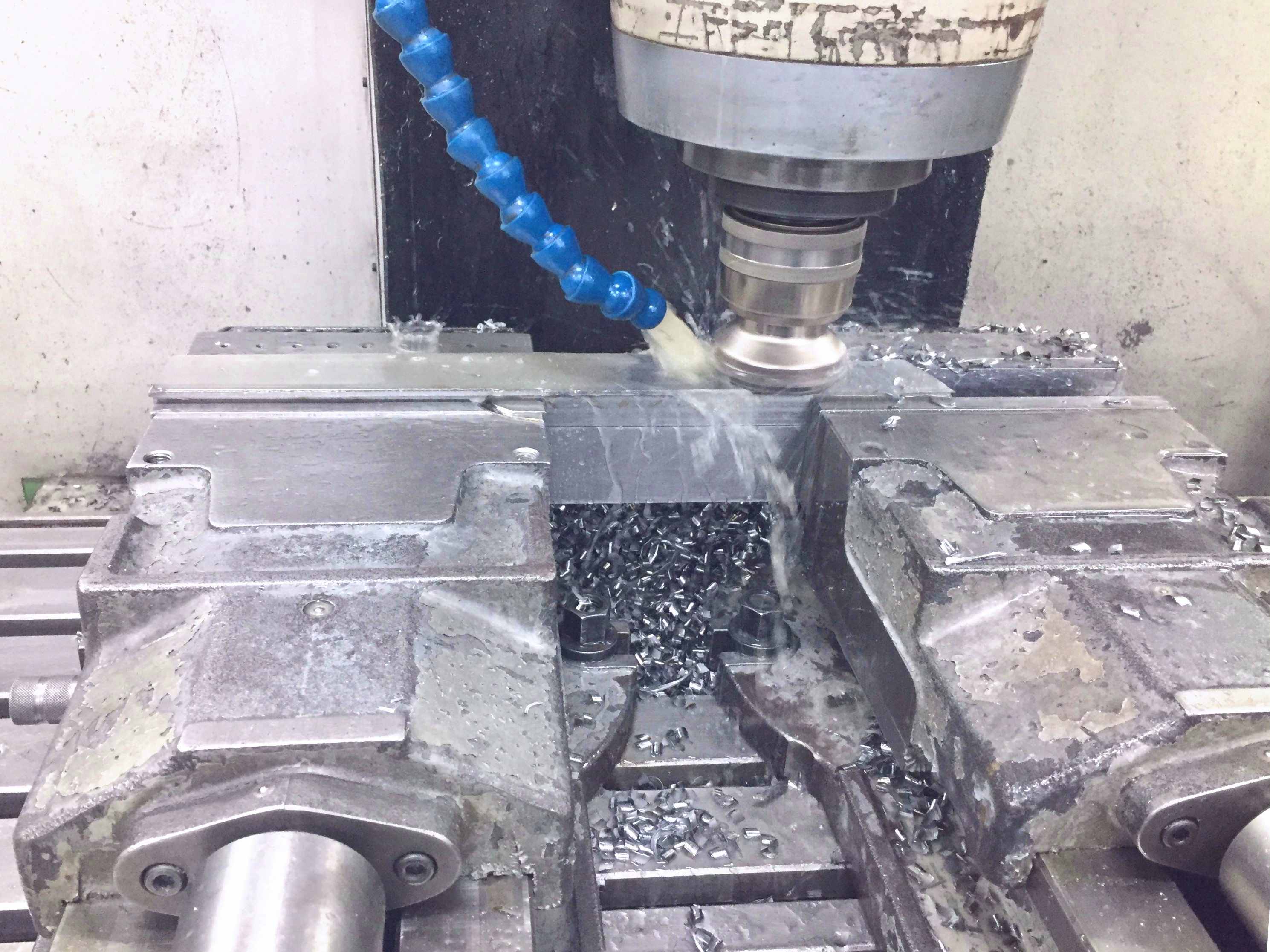 CNC Machining with a Double Vise and Strong Alkaline Water